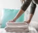 closeup-female-holding-folded-clothes
