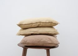 Minimal linen cushion covers on a chair